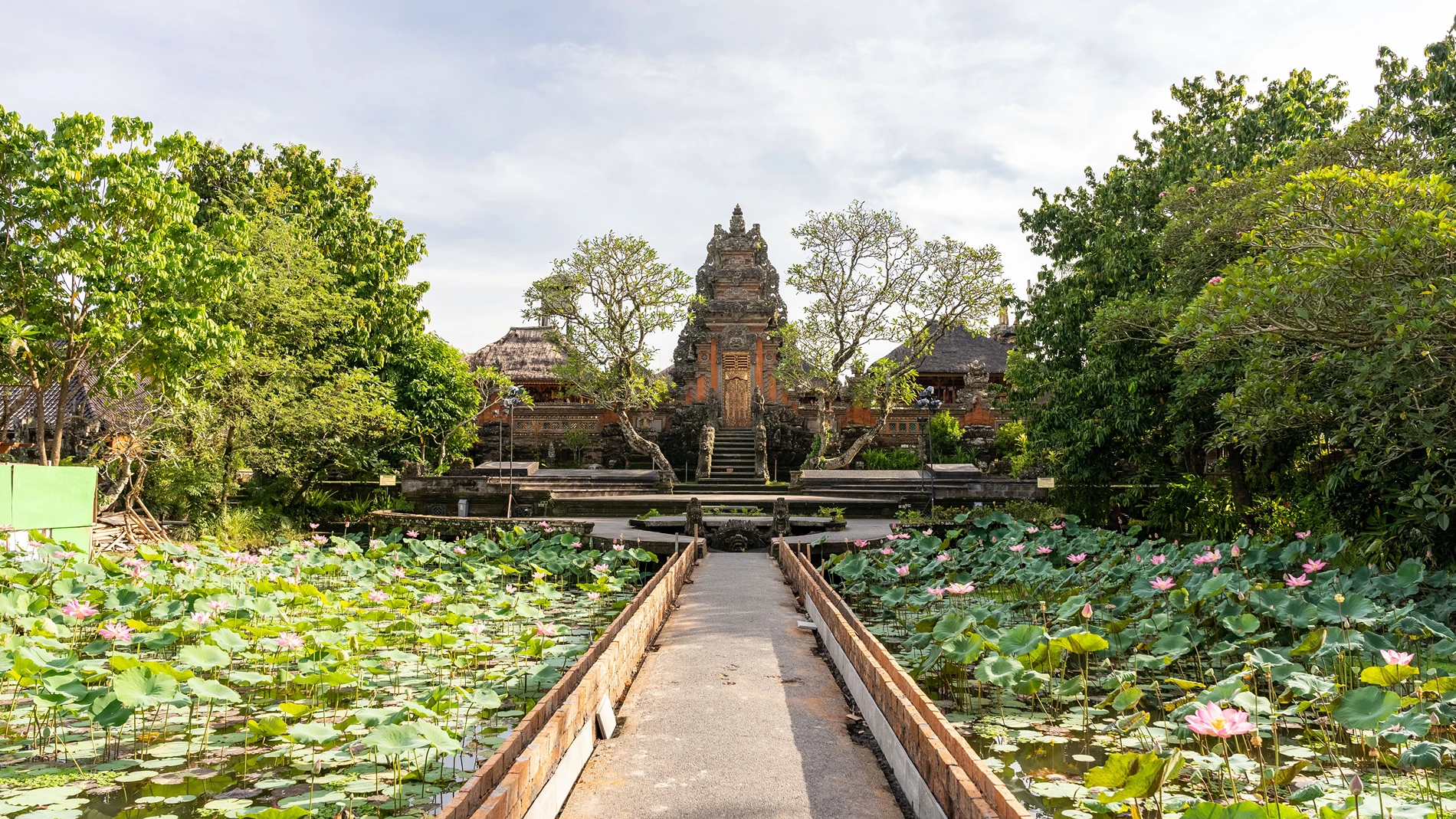 Lotus pond and carved entrance at Ubud Water Palace, Pura Taman Saraswati, Bali