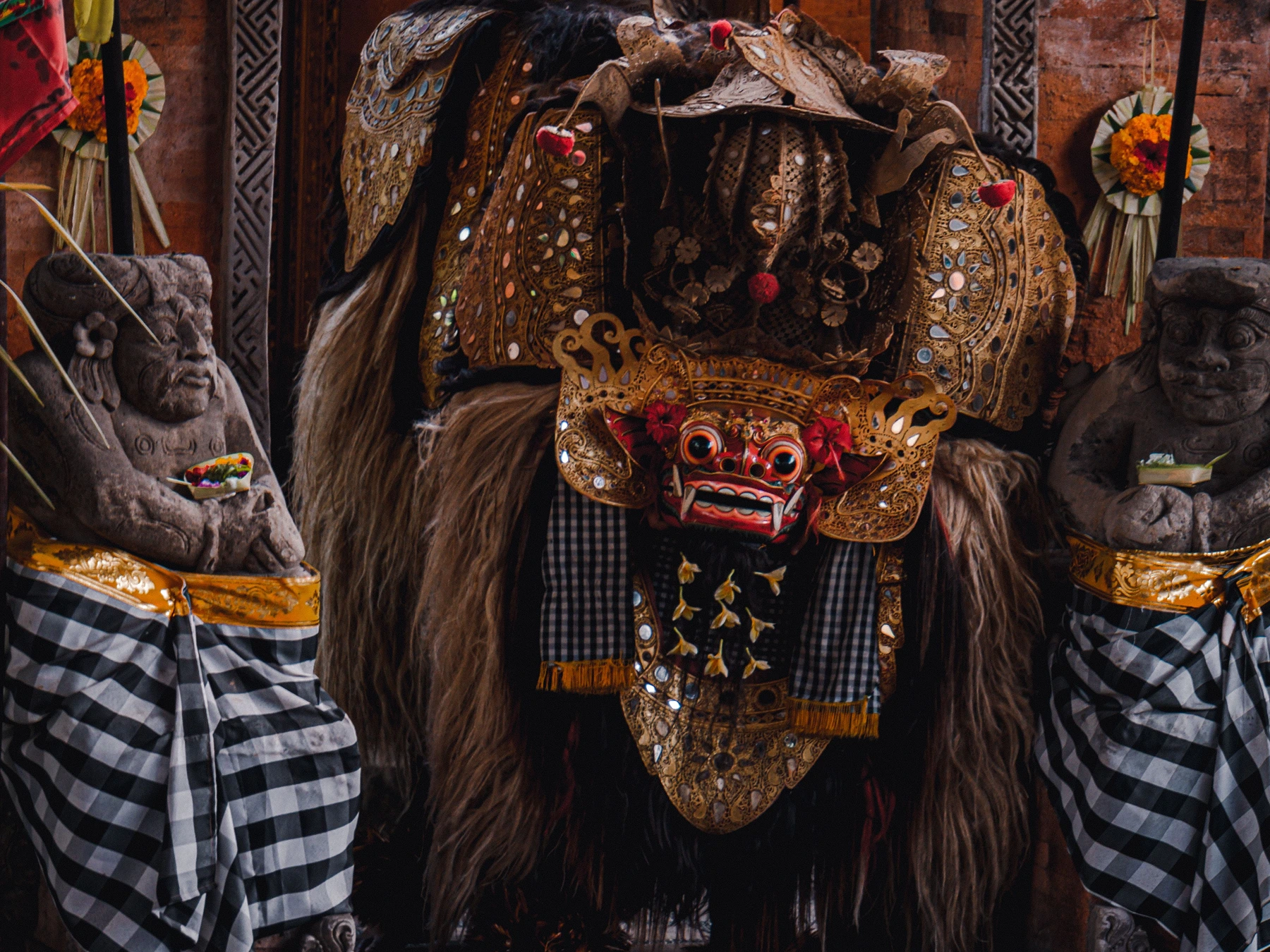 Traditional Barong Dance performance in Bali with a costumed Barong dancer