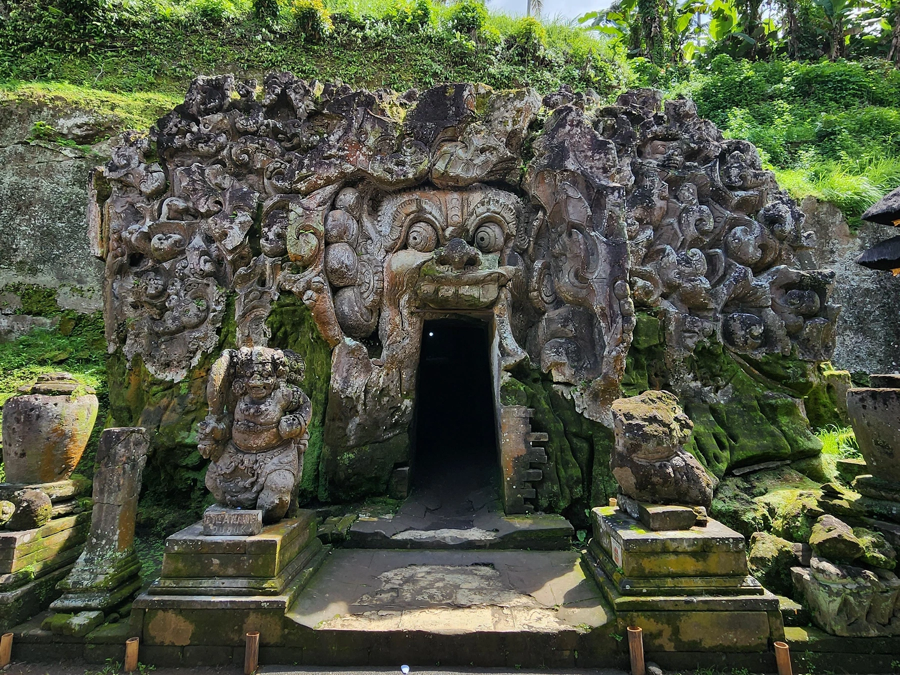 Carved stone entrance to Goa Gajah Temple near Ubud, Bali