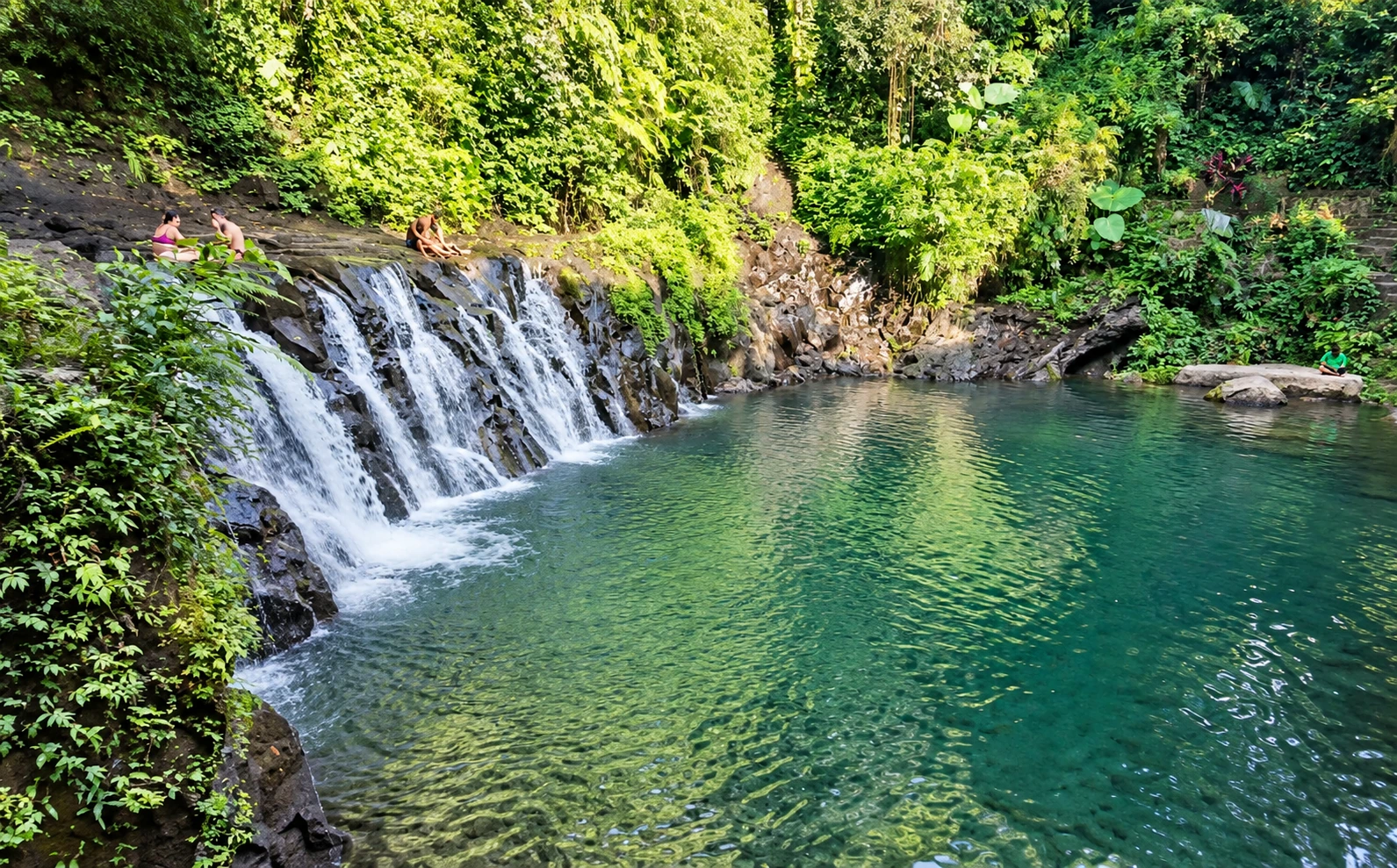 Natural swimming pool at Taman Sari Waterfall near Ubud, Bali